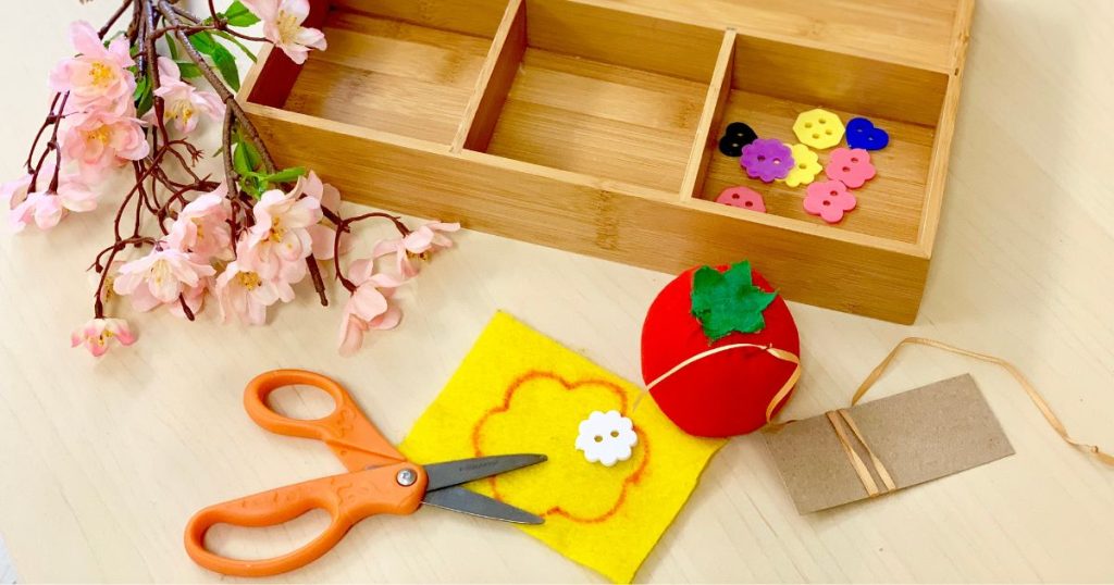 sewing activities for preschool- supplies for sewing a button on a felt flower